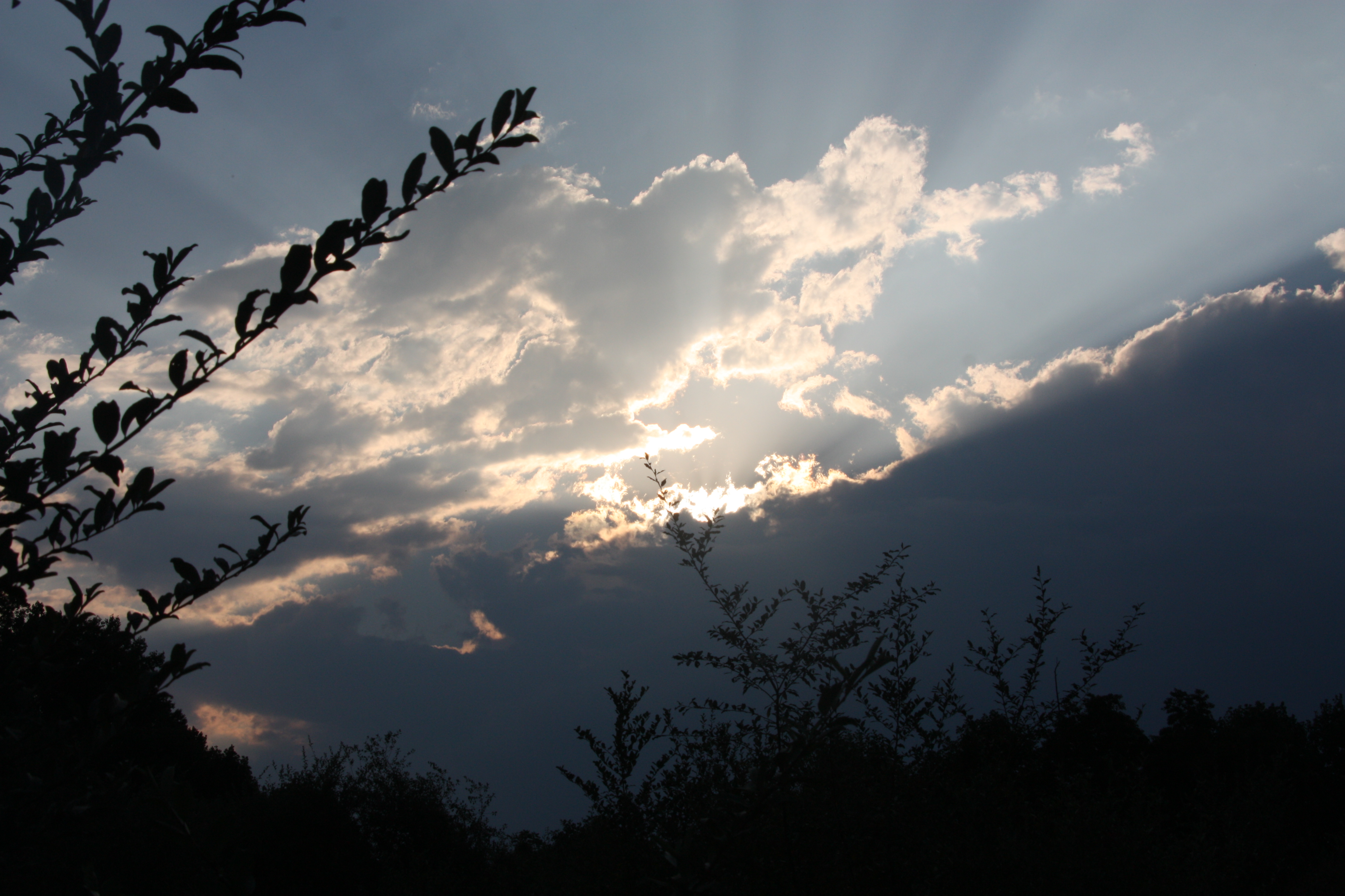 sun rays piercing clouds